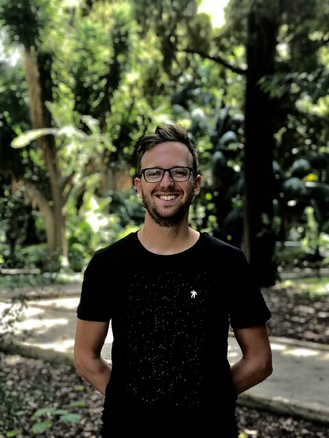 Jordy, founder of Cresco Pruning, standing in a lush green garden
